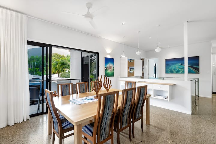 Timber dining table made from local Flindersia acuminata, with dining chairs.