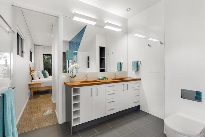 Master ensuite vanity, with a view through to the bedroom.