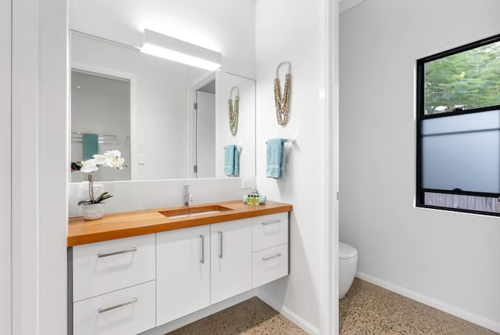 Main bathroom vanity with timber bench top.