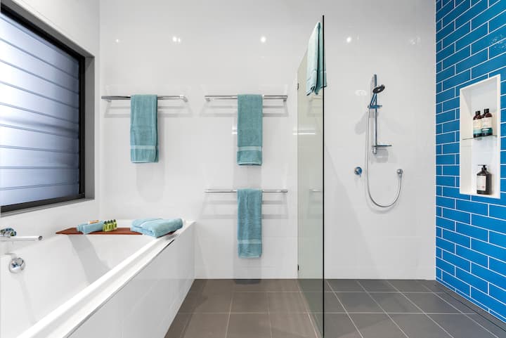 Bathing room with a bath and walk-in shower.